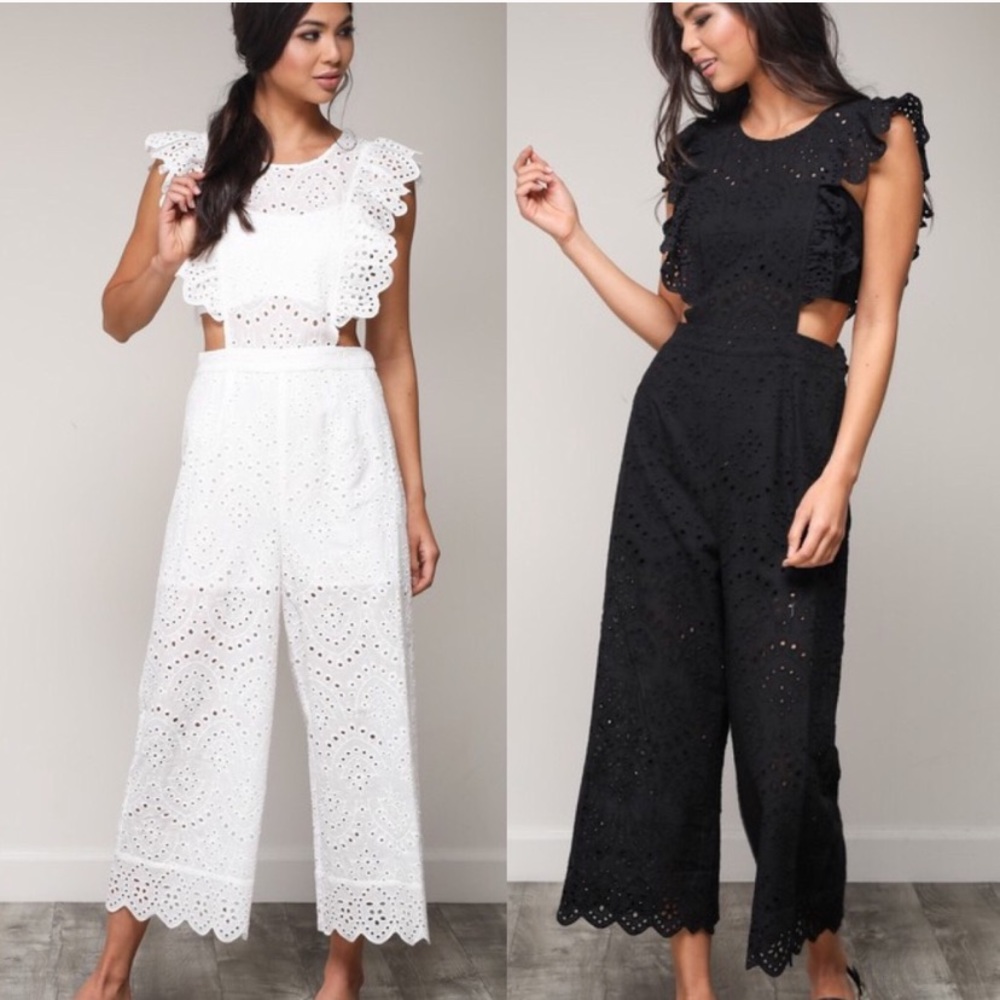 White cutout jumpsuit with ruffle details! 🤍